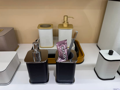 Giobagnara | Polo Leather Bathroom Set: Leather-covered body with rounded silhouette and metal pump in chrome, bronze, or brass | The Bathroom | 2Jour Concierge, your luxury lifestyle shop | luxury soap dispenser, Giobagnara Polo, leather bathroom accessory, Italian designer soap dispenser
