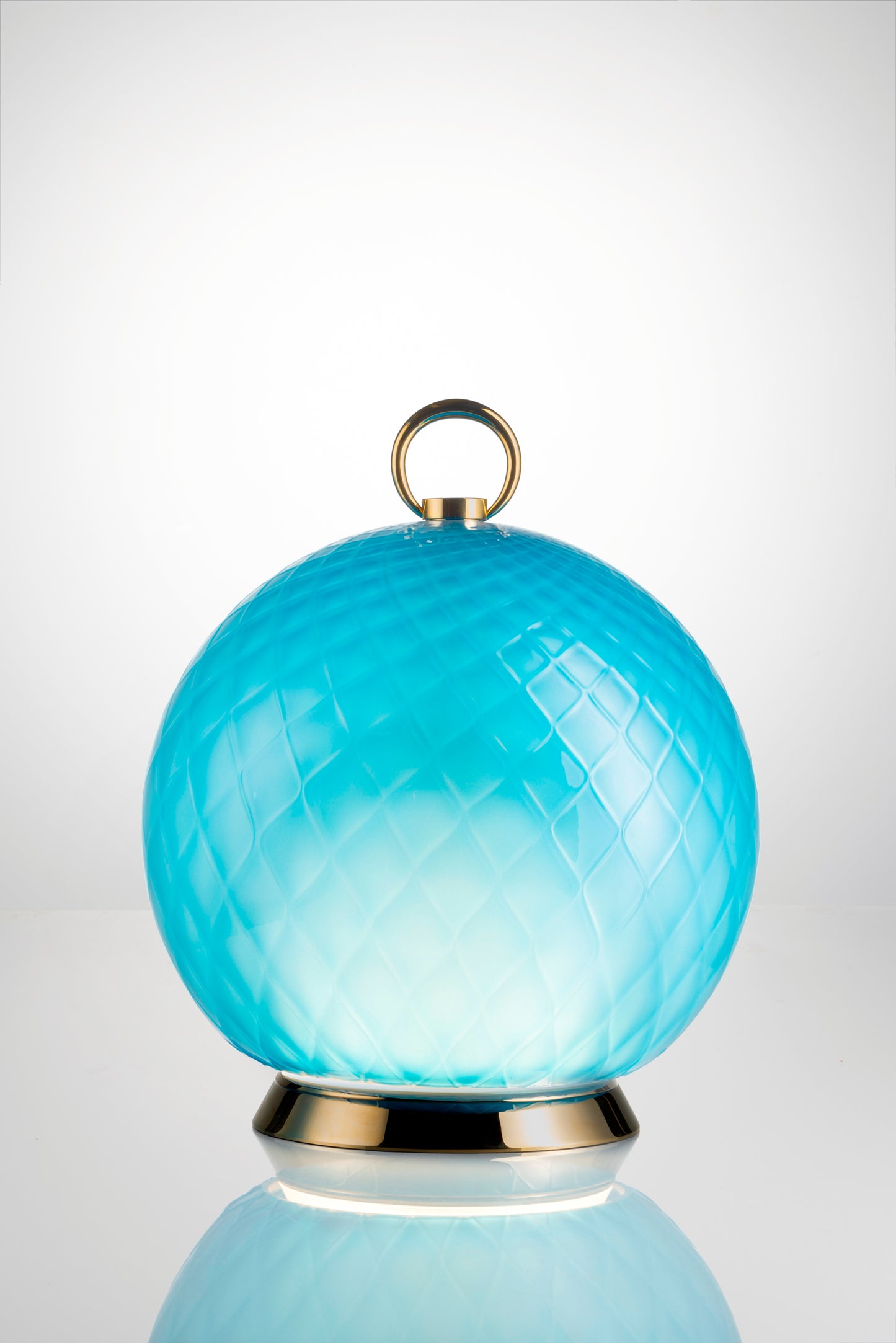 Gran Balloton Luce LED Lamp by Venini | Features distinctive crossed relief effect achieved through the "balloton" technique | Touch/app-dimmable LED technology allows adjustable light intensity | Creates enchanting kaleidoscopic effects with glass | Transforms surroundings into a dance of colors and reflections | Ideal for creating the perfect atmosphere for any occasion | Home Decor Lighting | 2Jour Concierge, your luxury lifestyle shop