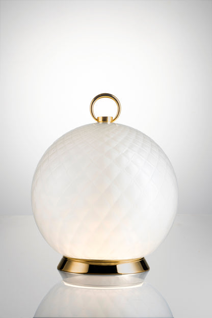 Gran Balloton Luce LED Lamp by Venini | Features distinctive crossed relief effect achieved through the "balloton" technique | Touch/app-dimmable LED technology allows adjustable light intensity | Creates enchanting kaleidoscopic effects with glass | Transforms surroundings into a dance of colors and reflections | Ideal for creating the perfect atmosphere for any occasion | Home Decor Lighting | 2Jour Concierge, your luxury lifestyle shop