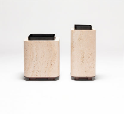 Giobagnara x Glenn Sestig Lloyd Vase | Travertine structure with a removable burnished-brushed bronze container seated on a walnut- or wenge-finished wood base, blending organic stone with metallic warmth | Crafted in Italy by Giobagnara in collaboration with designer Glenn Sestig | Home Decor / Vases | 2Jour Concierge, your luxury lifestyle shop