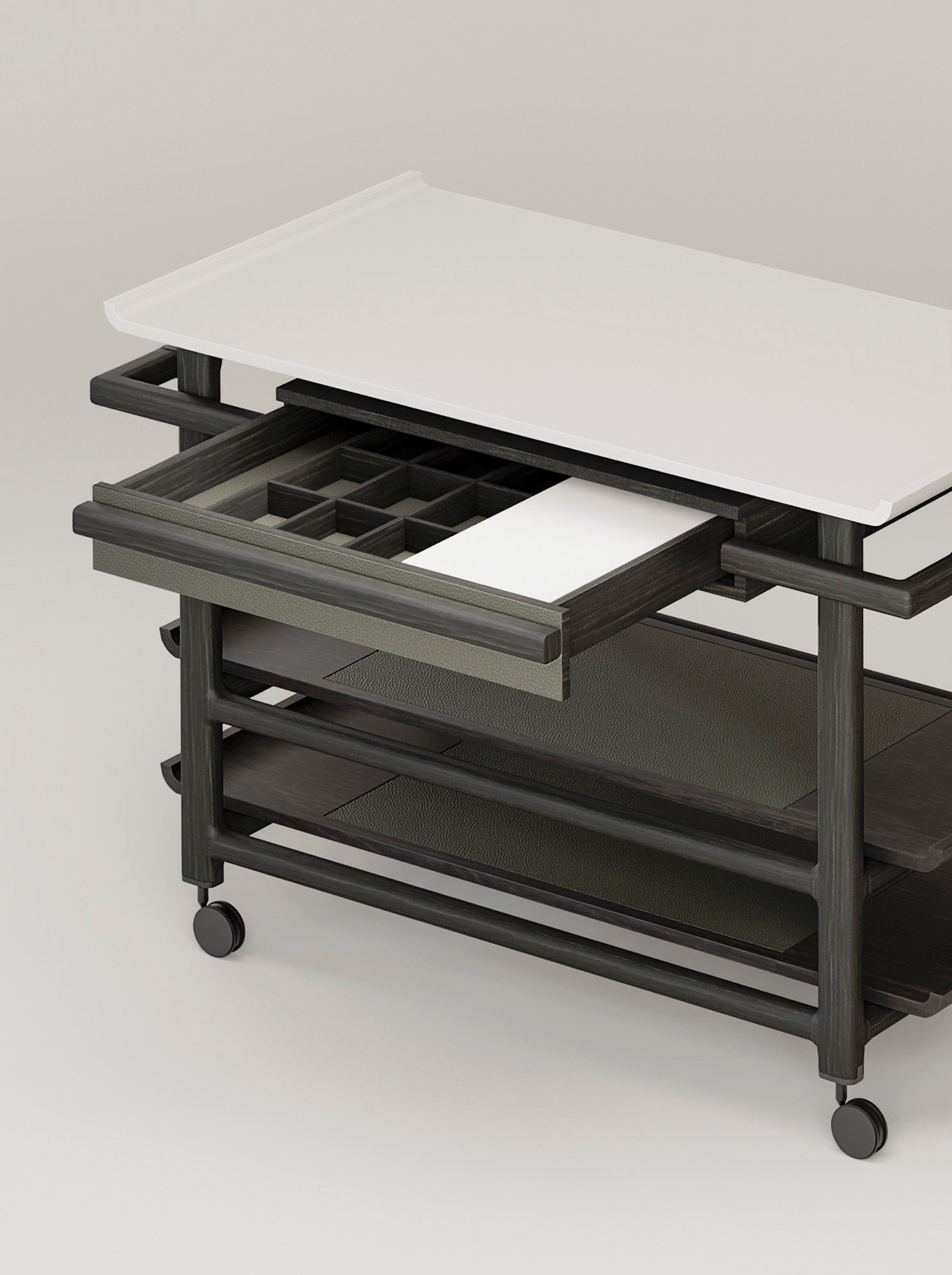 Giobagnara x Glenn Sestig Lloyd Tabi serving trolley | Elegant serving cart with a Corian® top and fine leather-lined drawer | Wood structure available in dark walnut, wenge, or natural finishes | Includes Corian® chopping board and removable wooden dividers for customizable storage | Features burnished brushed bronze wheels for smooth mobility | A refined and functional piece for serving and organizing essentials | Home furniture & serving accessories | 2Jour Concierge, your luxury lifestyle shop