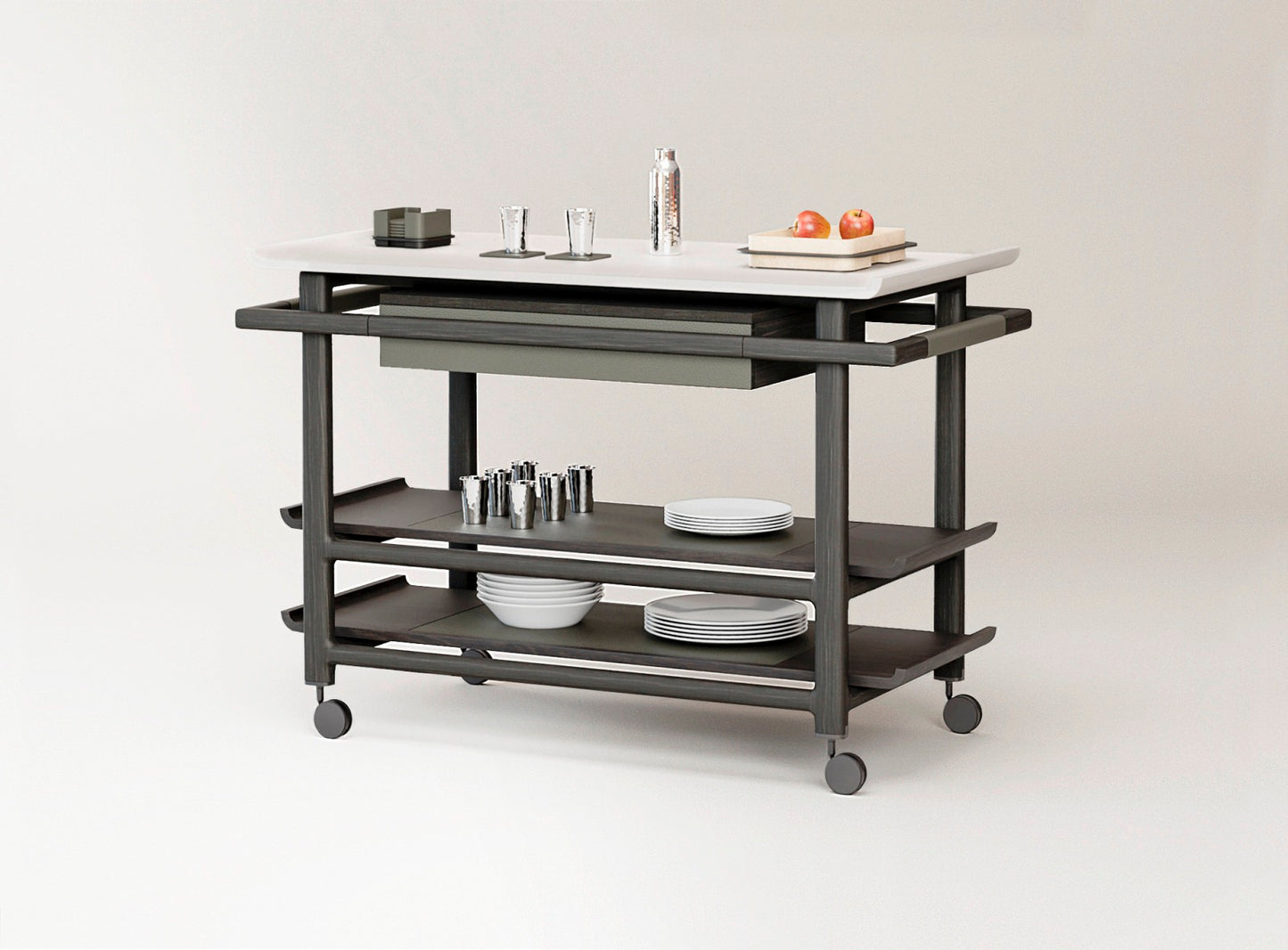 Giobagnara x Glenn Sestig Lloyd Tabi serving trolley | Elegant serving cart with a Corian® top and fine leather-lined drawer | Wood structure available in dark walnut, wenge, or natural finishes | Includes Corian® chopping board and removable wooden dividers for customizable storage | Features burnished brushed bronze wheels for smooth mobility | A refined and functional piece for serving and organizing essentials | Home furniture & serving accessories | 2Jour Concierge, your luxury lifestyle shop