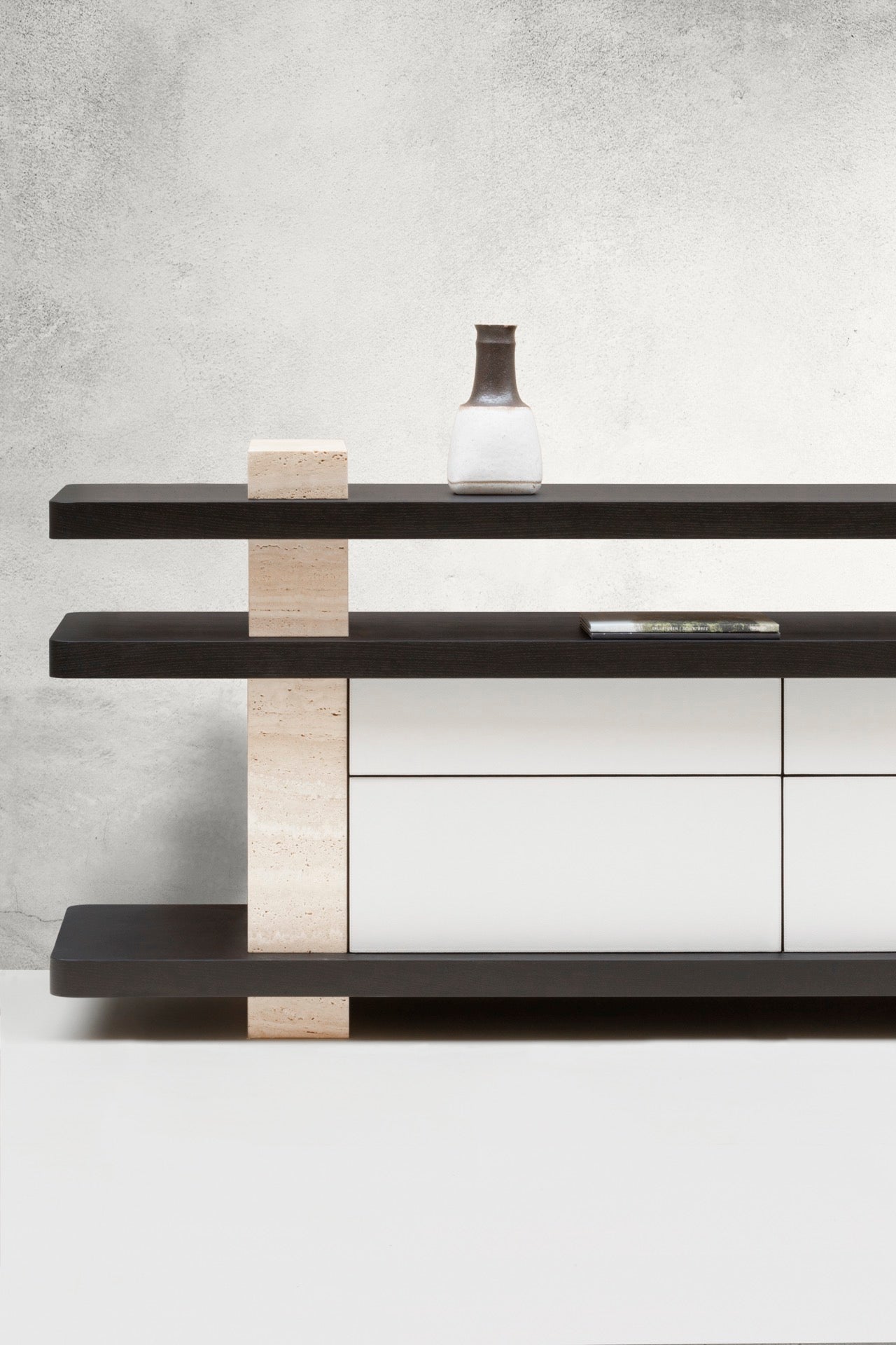 Giobagnara × Glenn Sestig Elliot | Console Table: Travertine in classic, walnut, titanium, yellow, or red with leather-covered wood base | Furniture / Console Tables + Étagères | 2Jour Concierge, your luxury lifestyle shop | contemporary interiors, refined craftsmanship, luxury design, architectural furniture, statement console