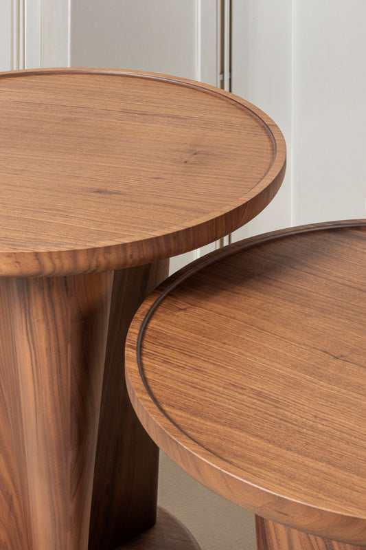 Giobagnara × Glenn Sestig Tanell | Round Walnut Wood Side Tables: Sculptural walnut base with natural or dark finishes, round top design | Furniture / Side Tables + Bar Tables | 2Jour Concierge, your luxury lifestyle shop | luxury interiors, refined living, executive residences, boutique hotels, yacht décor, office décor, contemporary design