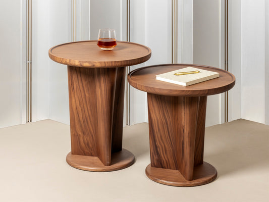 Giobagnara × Glenn Sestig Tanell | Round Walnut Wood Side Tables: Sculptural walnut base with natural or dark finishes, round top design | Furniture / Side Tables + Bar Tables | 2Jour Concierge, your luxury lifestyle shop | luxury interiors, refined living, executive residences, boutique hotels, yacht décor, office décor, contemporary design