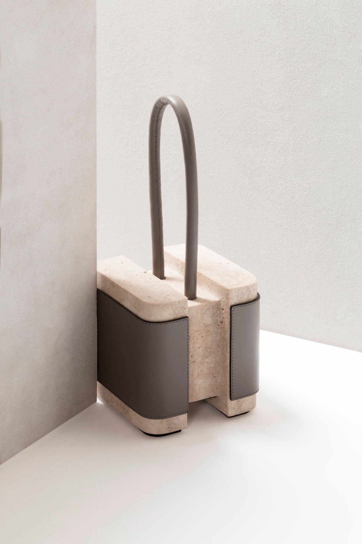 Giobagnara x Glenn Sestig Lloyd Leather & Marble Doorstop | Collaboration with Glenn Sestig | Stylish Design with Leather and Travertine | Leather Handle Available in Nappa Only | Explore a Range of Luxury Home Accessories at 2Jour Concierge, #1 luxury high-end gift & lifestyle shop