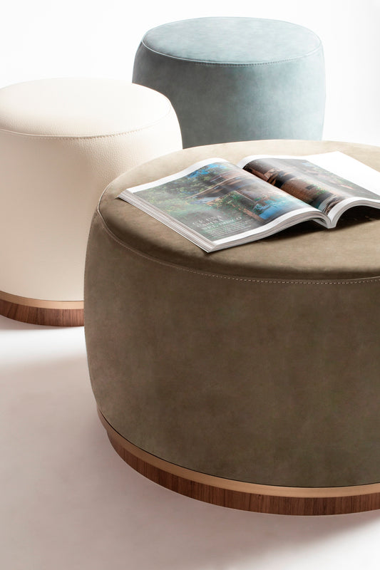 Riviere Dama Pouf | Upholstered leather pouf with a wooden base adorned with a fine metal ring | Elegant and luxurious design | Home Decor and Furniture | 2Jour Concierge, your luxury lifestyle shop