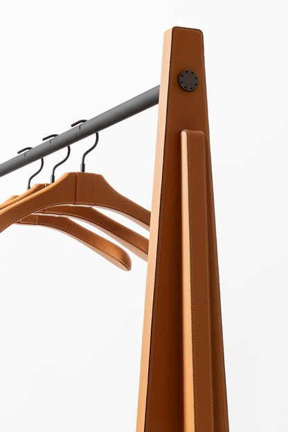 Giobagnara | Edoardo Clothes Rack: Leather-covered wood clothes rack with metal hanging bar | Serveware + Hospitality / Clothes Valets | 2Jour Concierge, your luxury lifestyle shop | premium garment storage for expensive interiors, dressing rooms, hospitality suites, and refined retail spaces