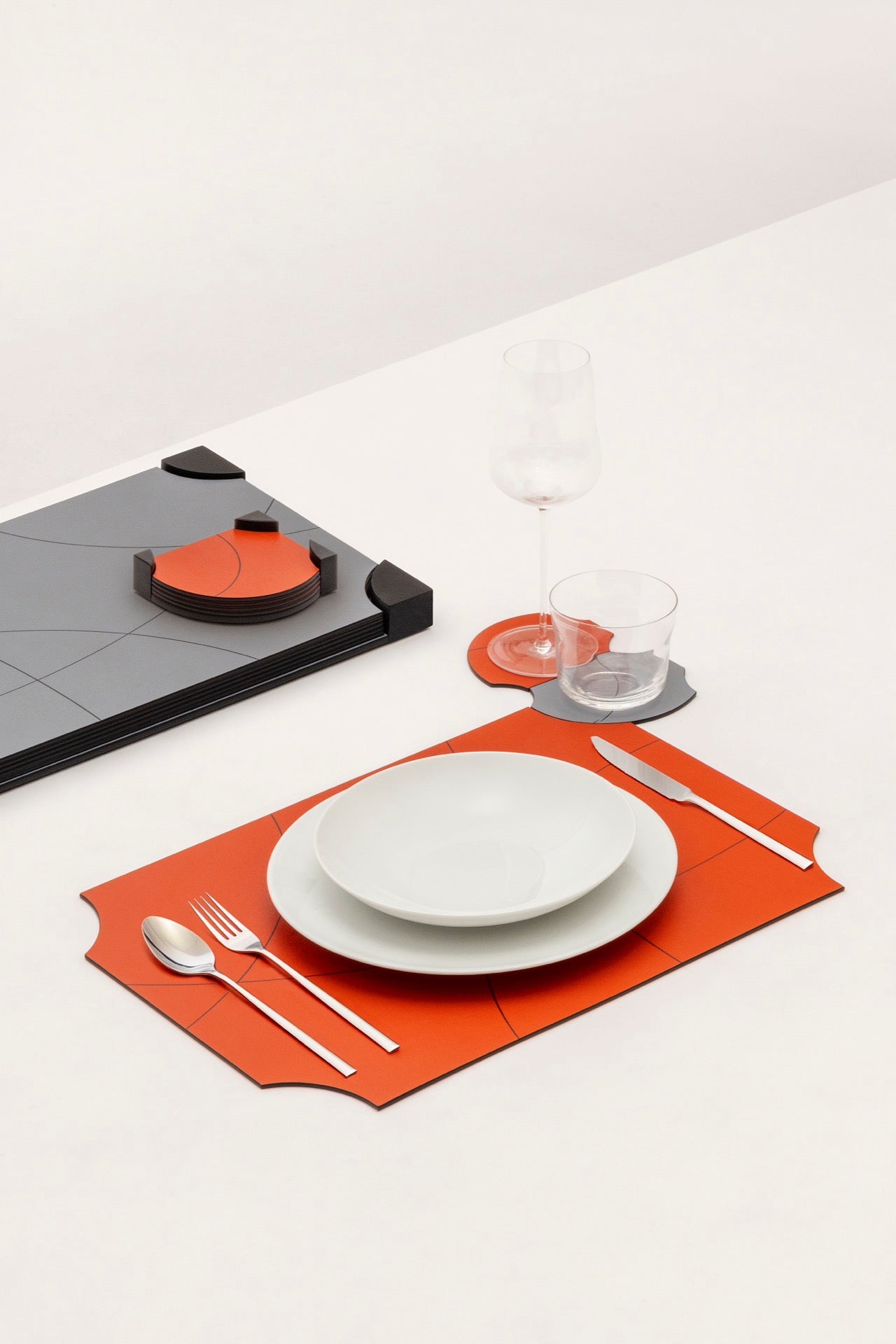 Giobagnara | Margo Placemat Set: Calfskin placemats with Corian® holder and graphic composition | Serveware + Hospitality / Placemats & Underplates | 2Jour Concierge, your luxury lifestyle shop | premium table settings for luxury interiors, dining environments, and hospitality concepts