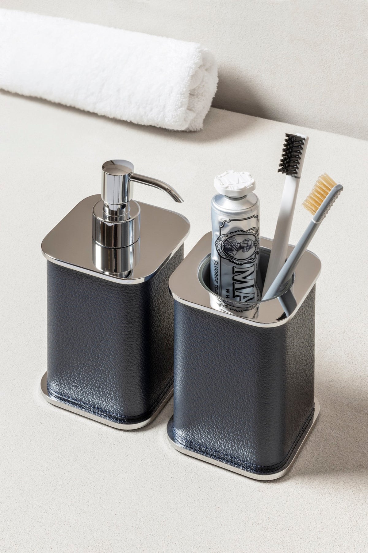 Giobagnara | Polo Leather Soap Dispenser: Leather-covered body with rounded silhouette and metal pump in chrome, bronze, or brass | The Bathroom | 2Jour Concierge, your luxury lifestyle shop | luxury soap dispenser, Giobagnara Polo, leather bathroom accessory, Italian designer soap dispenser