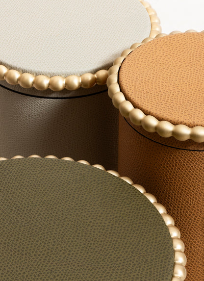 Giobagnara | Perla Round Trinket Box: Leather-covered round box with lid and metal ring of linked spheres | Decor | 2Jour Concierge, your luxury lifestyle shop | luxury trinket box, Giobagnara Perla, round leather box, Italian designer box, leather storage box