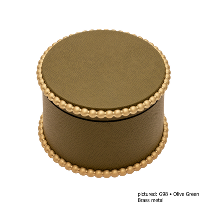 Giobagnara | Perla Round Trinket Box: Leather-covered round box with lid and metal ring of linked spheres | Decor | 2Jour Concierge, your luxury lifestyle shop | luxury trinket box, Giobagnara Perla, round leather box, Italian designer box, leather storage box