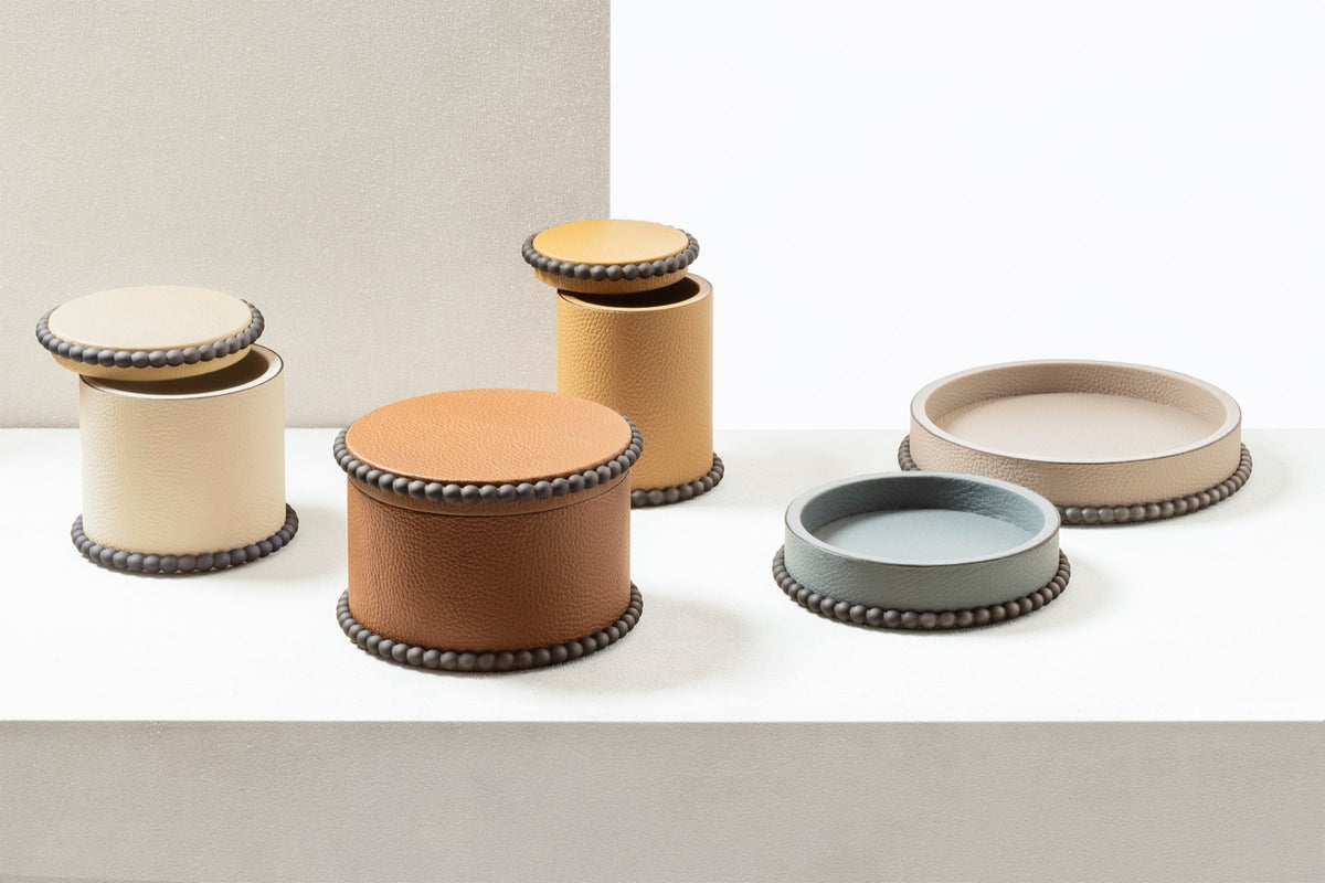 Giobagnara | Perla Round Valet Tray: Leather-covered round form with metal ring of linked spheres in chrome, bronze, or brass | Decor | 2Jour Concierge, your luxury lifestyle shop | luxury valet tray, Giobagnara Perla, round leather tray, Italian luxury decor, designer catch-all tray