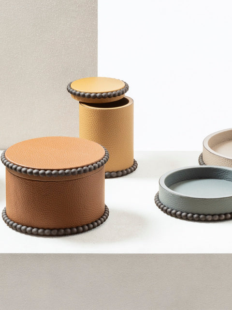 Giobagnara | Perla Round Trinket Box: Leather-covered round box with lid and metal ring of linked spheres | Decor | 2Jour Concierge, your luxury lifestyle shop | luxury trinket box, Giobagnara Perla, round leather box, Italian designer box, leather storage box