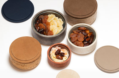 Giobagnara | Naxos Leather & Marble Bowl: Travertine marble bowl with leather-covered lid in multiple sizes | Decor / Trinket Boxes | 2Jour Concierge, your luxury lifestyle shop | luxury decorative storage, premium stone objects for expensive interiors, bedside tables, desks, and curated shelving