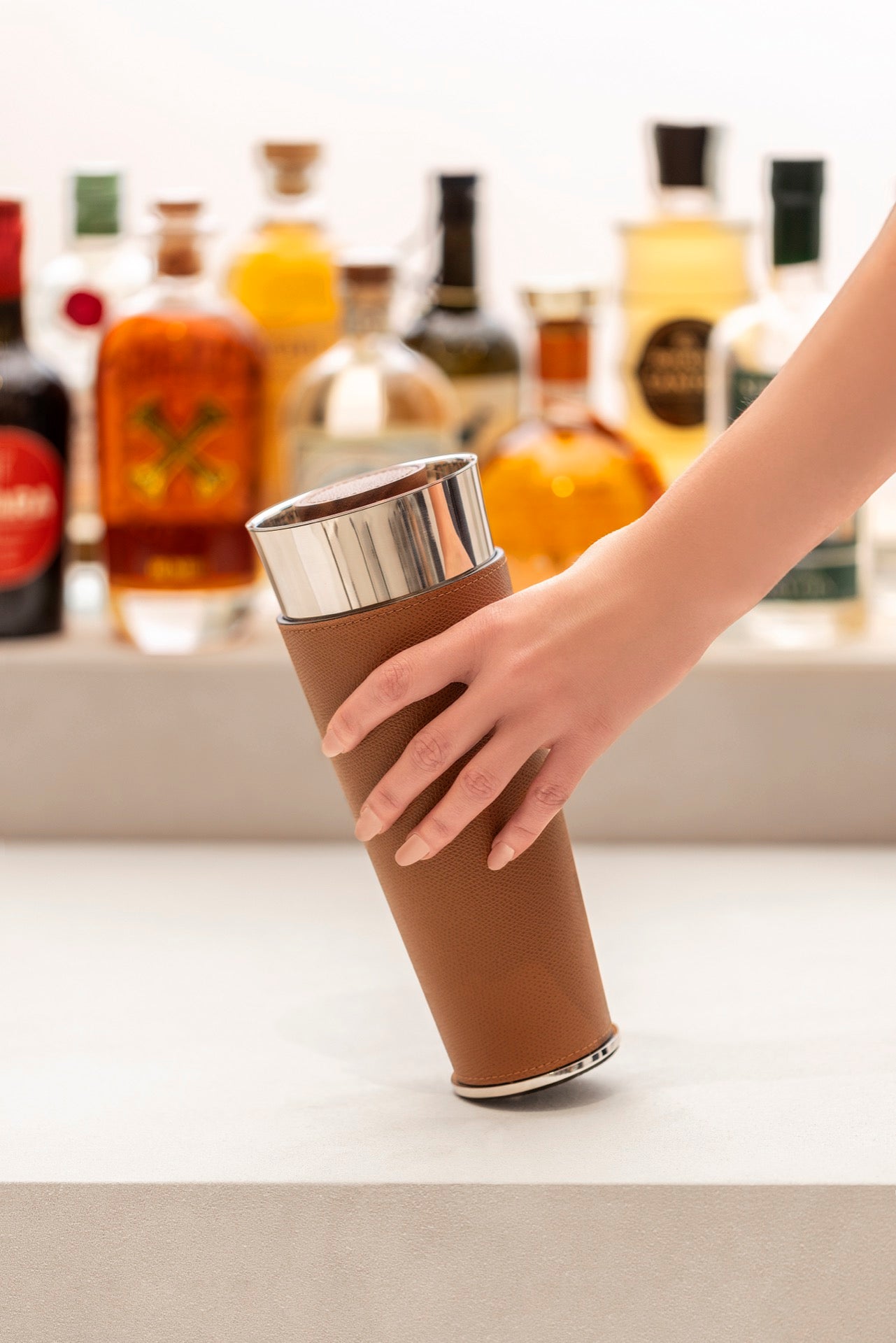 Giobagnara | Ocean Shaker: Leather-covered stainless steel cocktail shaker with walnut wood top | Serveware + Hospitality / Beverage & Extra Accessories | 2Jour Concierge, your luxury lifestyle shop | premium bar accessories, luxury cocktail tools for expensive interiors, private bars, and refined entertaining spaces