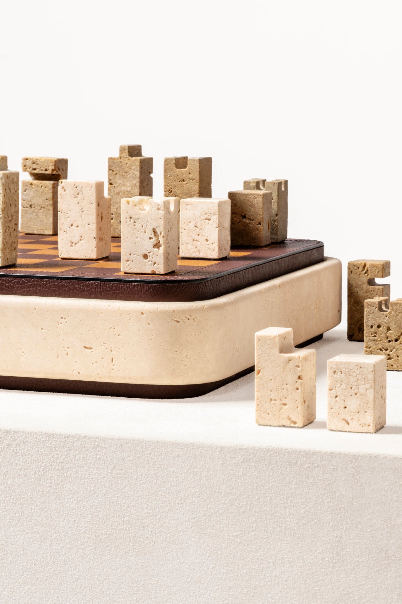 Giobagnara | Rodi Chess: Travertine chess set with leather-covered board and integrated storage | Games / Chess Sets | 2Jour Concierge, your luxury lifestyle shop | premium game sets for expensive interiors, private libraries, studies, and curated living rooms