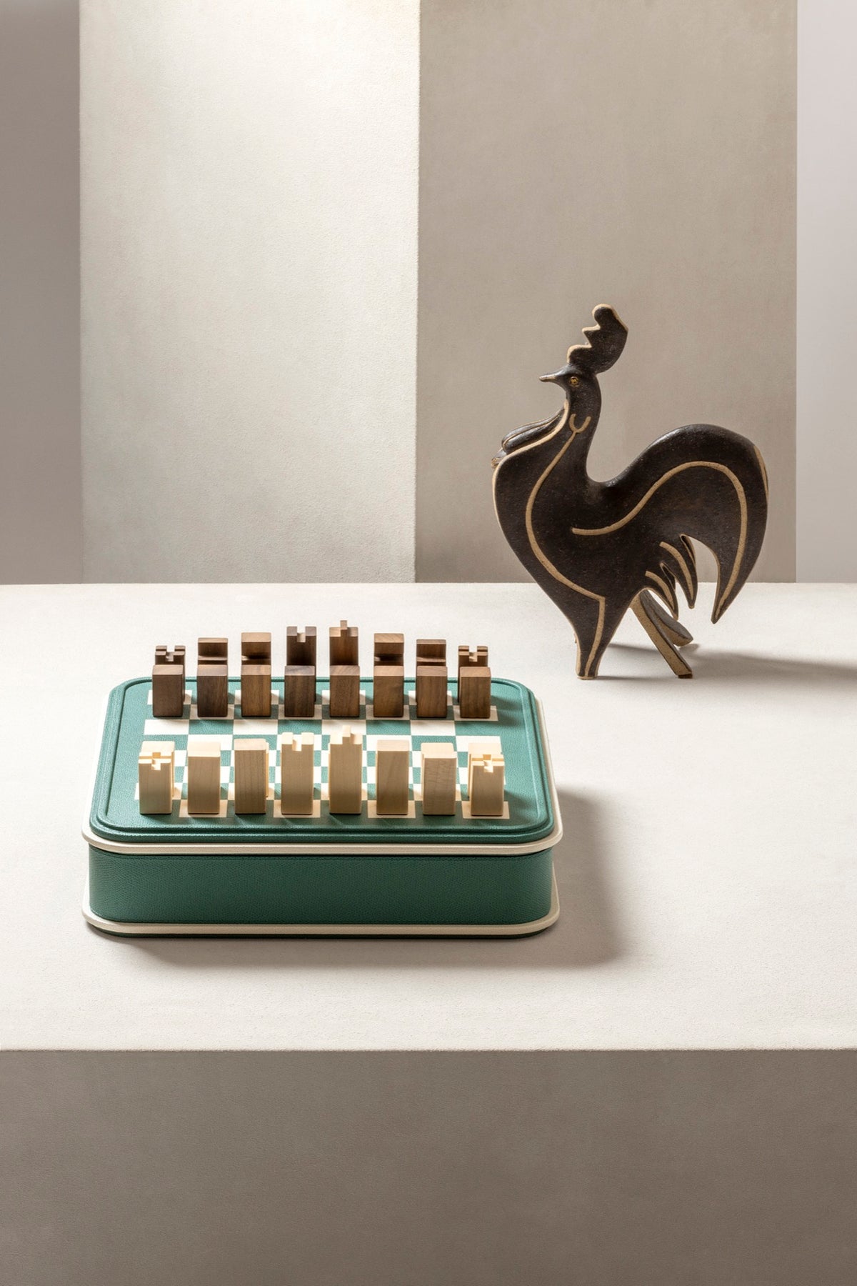 Giobagnara | Rolli Chess and Draughts Set: Leather-covered case with marquetry lid, maple and walnut pieces, leather-inlaid draughts | Game Room | 2Jour Concierge, your luxury lifestyle shop | luxury chess set, Giobagnara Rolli, leather chess board, Italian designer game set, luxury board game