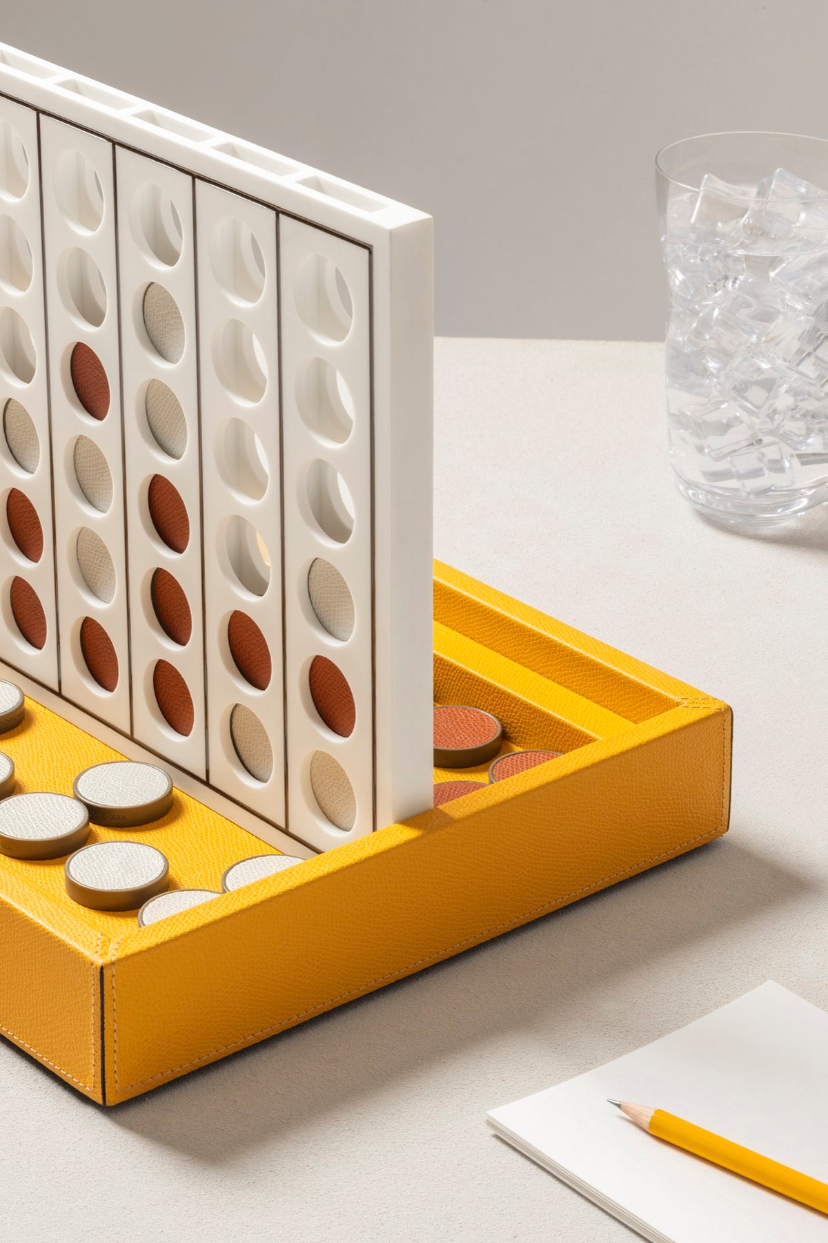 Giobagnara | Lerici Connect Four Game Set: Leather-covered wood base with plexiglass playing field and walnut chips with leather inserts | Game Room | 2Jour Concierge, your luxury lifestyle shop | luxury connect four, Giobagnara Lerici, leather game set, Italian designer game