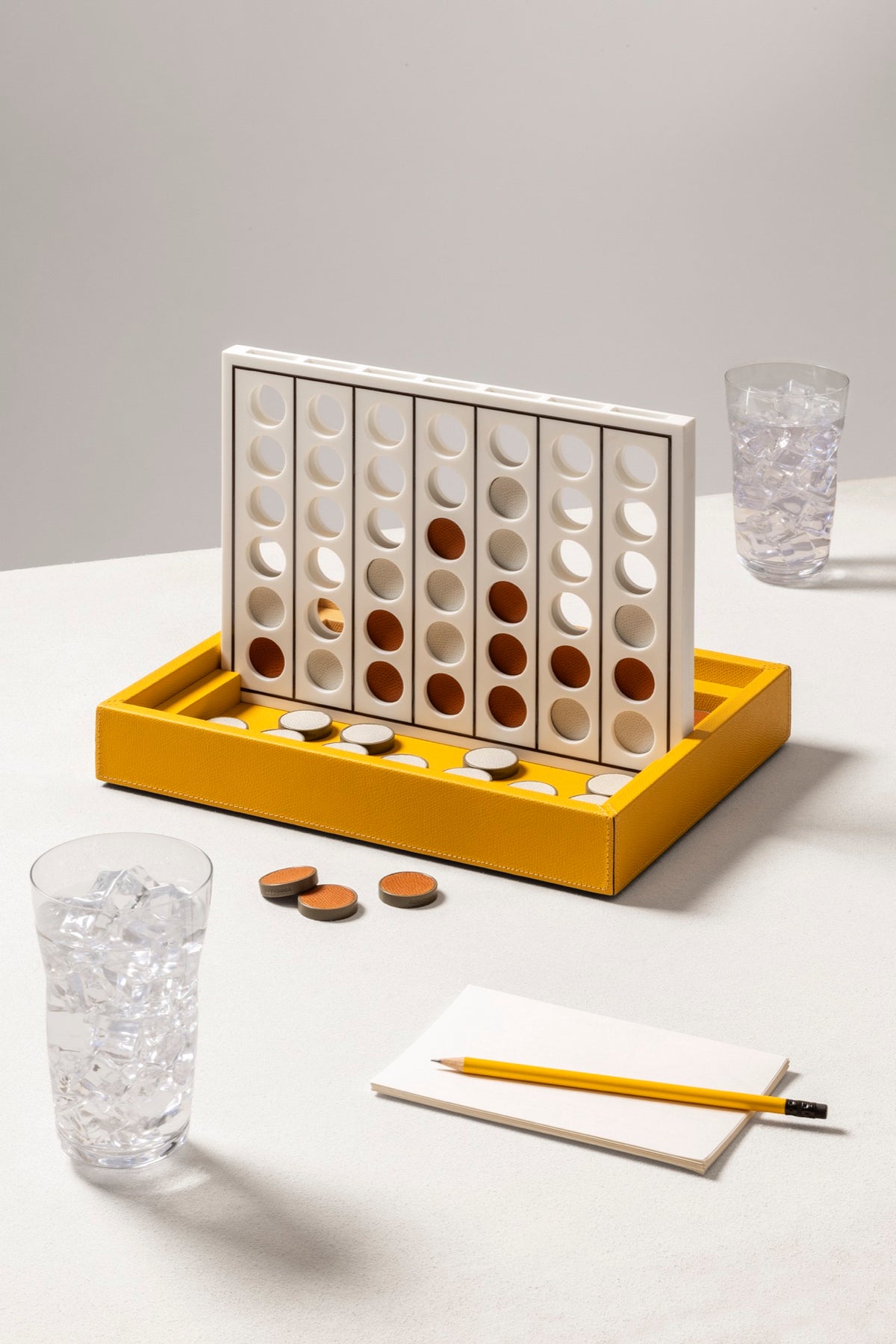Giobagnara | Lerici Connect Four Game Set: Leather-covered wood base with plexiglass playing field and walnut chips with leather inserts | Game Room | 2Jour Concierge, your luxury lifestyle shop | luxury connect four, Giobagnara Lerici, leather game set, Italian designer game