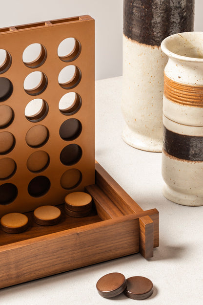 Giobagnara | Structura Connect Four Game Set: Wood structure with sole leather playing field and chips in brown and natural | Game Room | 2Jour Concierge, your luxury lifestyle shop | luxury connect four, Giobagnara Structura, sole leather game set, Italian designer game