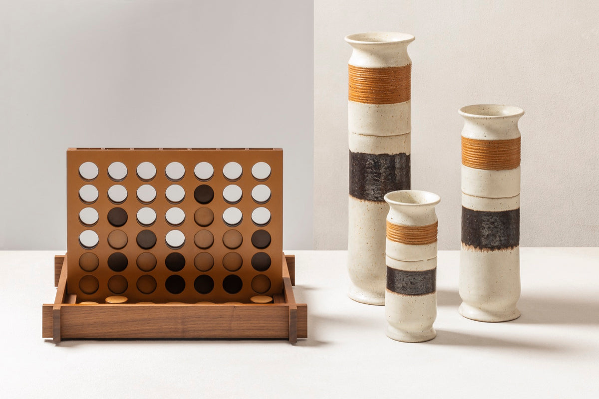 Giobagnara | Structura Connect Four Game Set: Wood structure with sole leather playing field and chips in brown and natural | Game Room | 2Jour Concierge, your luxury lifestyle shop | luxury connect four, Giobagnara Structura, sole leather game set, Italian designer game