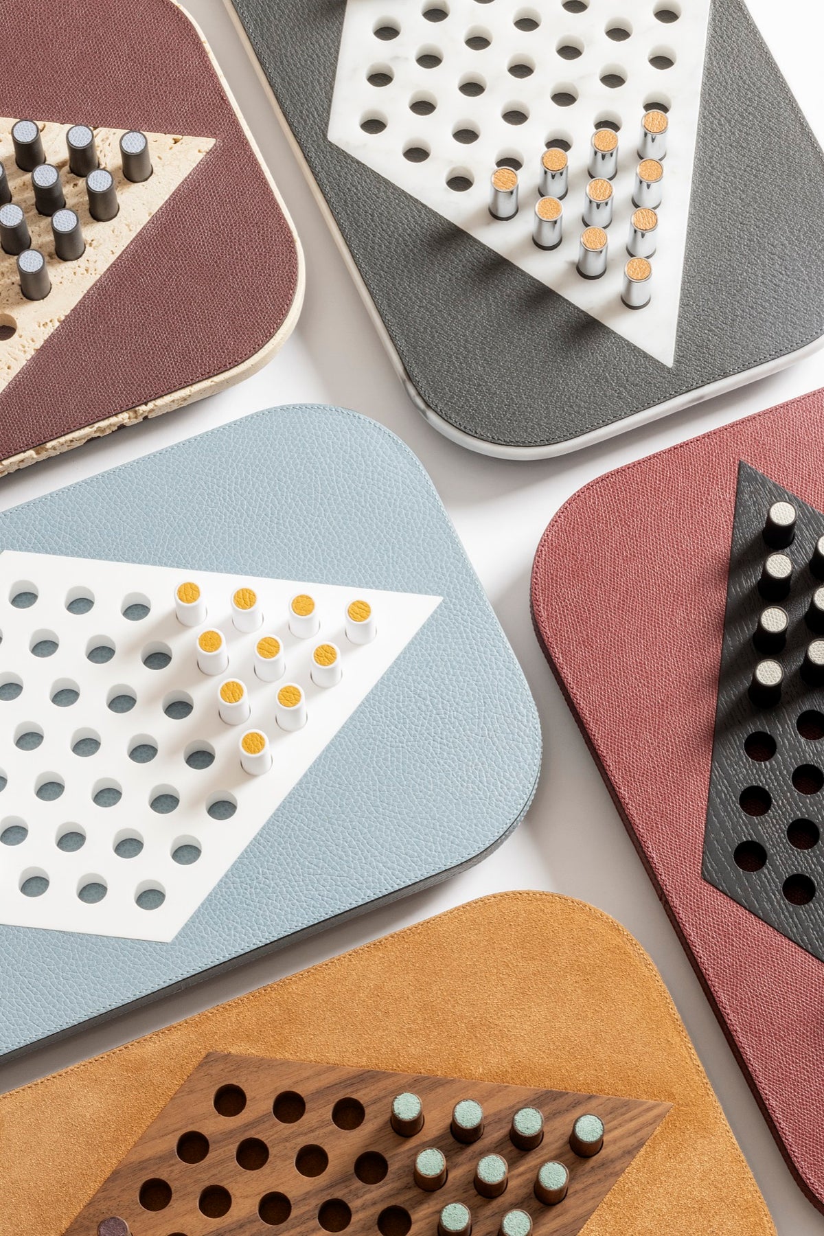 Giobagnara | Delos Chinese Checkers Set: Leather-covered board with playing pieces in wood, marble, or Corian® | Game Room | 2Jour Concierge, your luxury lifestyle shop | luxury chinese checkers, Giobagnara Delos, leather game set, Italian designer board game