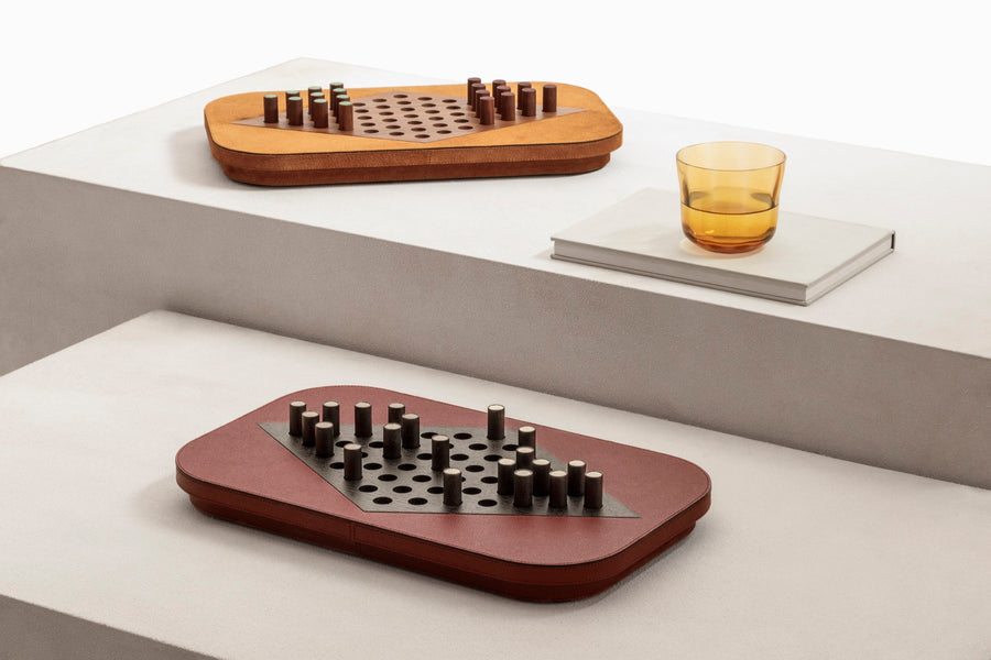 Giobagnara | Delos Chinese Checkers Set: Leather-covered board with playing pieces in wood, marble, or Corian® | Game Room | 2Jour Concierge, your luxury lifestyle shop | luxury chinese checkers, Giobagnara Delos, leather game set, Italian designer board game