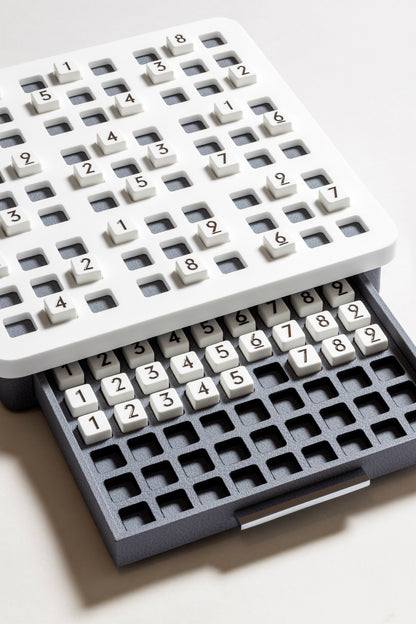 Giobagnara | Delos Sudoku Game Set Corian®: Corian® board with 81 Corian® pieces with engraved numbers | Game Room | 2Jour Concierge, your luxury lifestyle shop | luxury sudoku Corian, Giobagnara Delos, Corian sudoku board, Italian designer puzzle