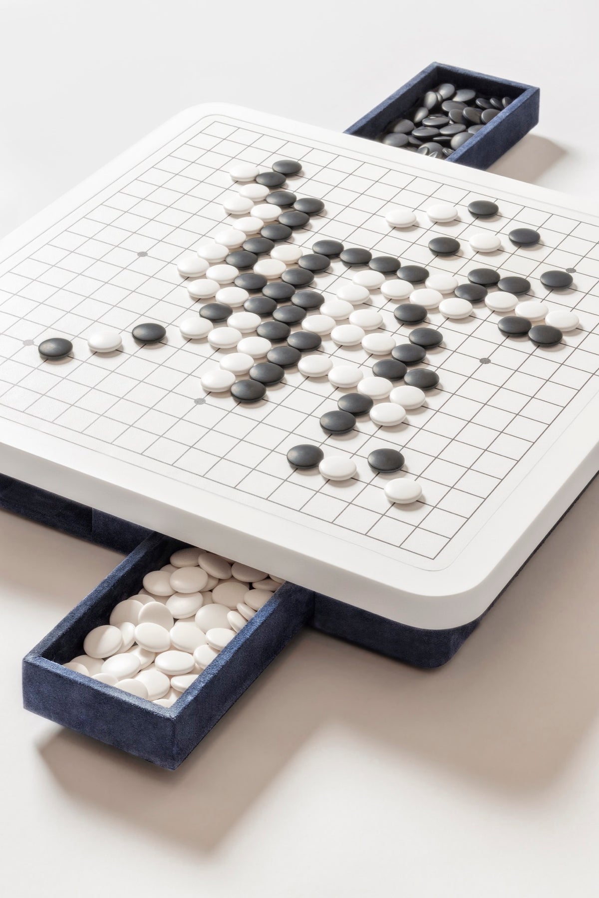 Giobagnara | Delos Go Game Set Corian®: Corian® top with digital-printed leather playing field and Corian® beads | Game Room | 2Jour Concierge, your luxury lifestyle shop | luxury go game Corian, Giobagnara Delos, Corian game board, Italian designer game set