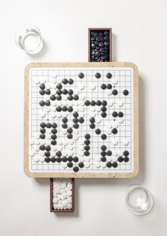 Giobagnara | Delos Go Game Set Marble: Arabescato white or travertino top with digital-printed leather playing field and Corian® beads | Game Room | 2Jour Concierge, your luxury lifestyle shop | luxury go game marble, Giobagnara Delos, marble game board, Italian designer game set