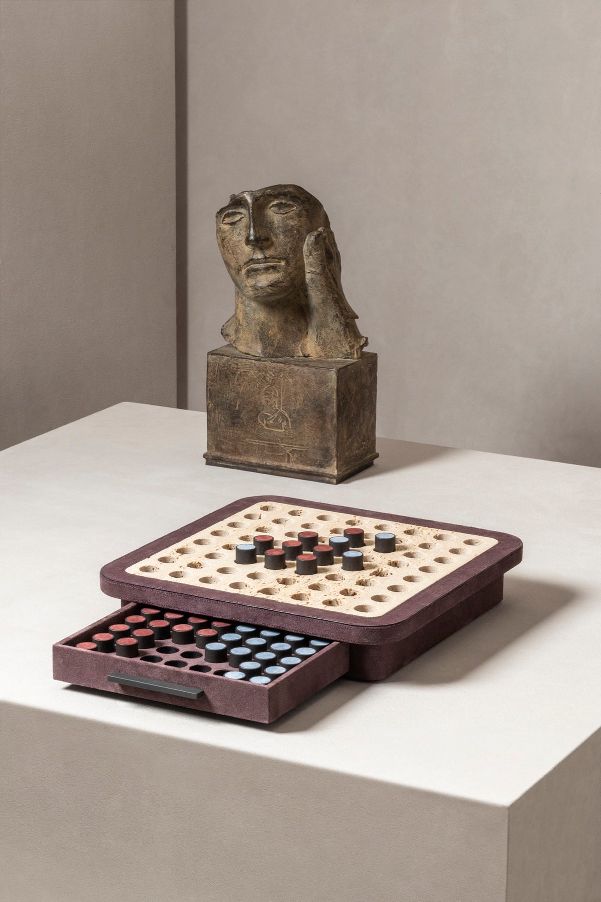Giobagnara | Delos Othello Game Set Marble: Arabescato white or travertino leather-covered board with metal playing pieces and leather inserts | Game Room | 2Jour Concierge, your luxury lifestyle shop | luxury othello marble, Giobagnara Delos, marble game board, Italian designer game