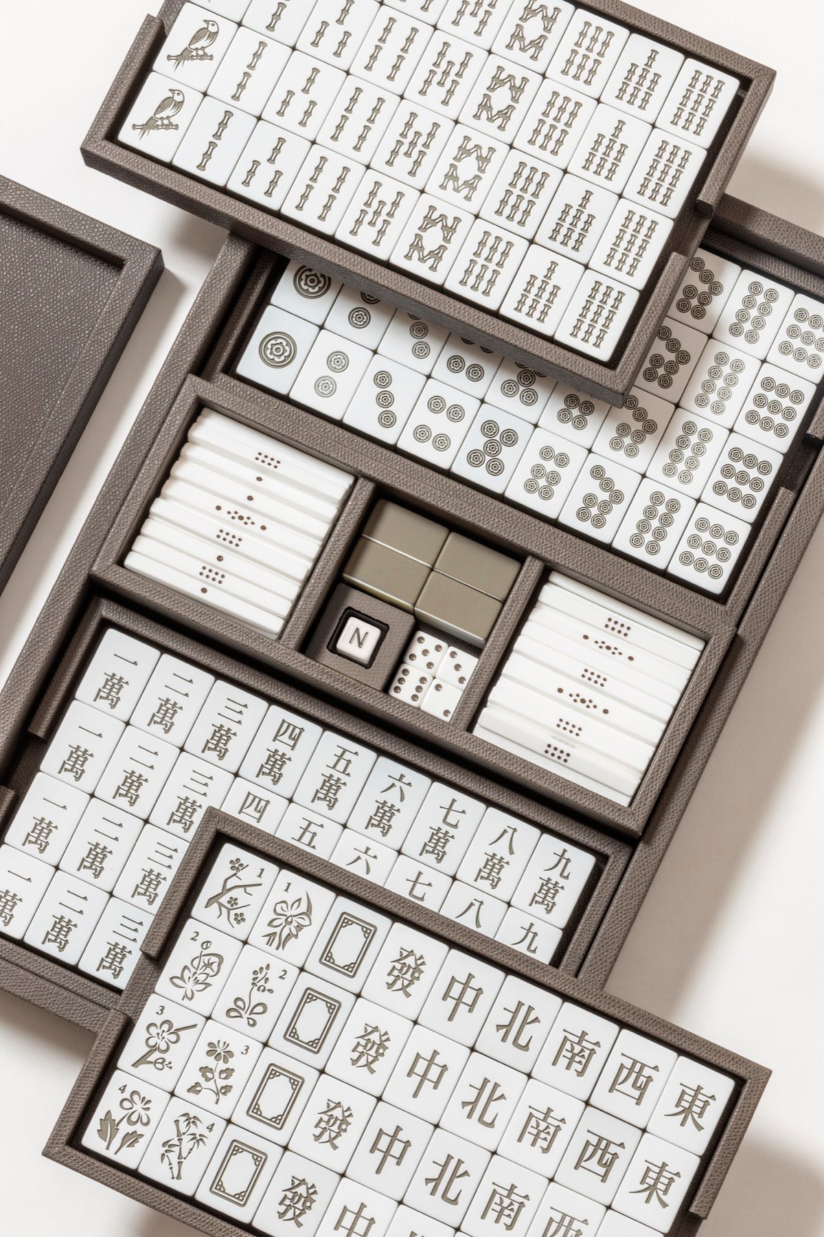 Giobagnara | Mahjong Game Set: Leather-covered wood case with opaque plexiglass tiles, sticks, and dice | Game Room | 2Jour Concierge, your luxury lifestyle shop | luxury mahjong set, Giobagnara mahjong, leather game case, Italian designer game, complete mahjong