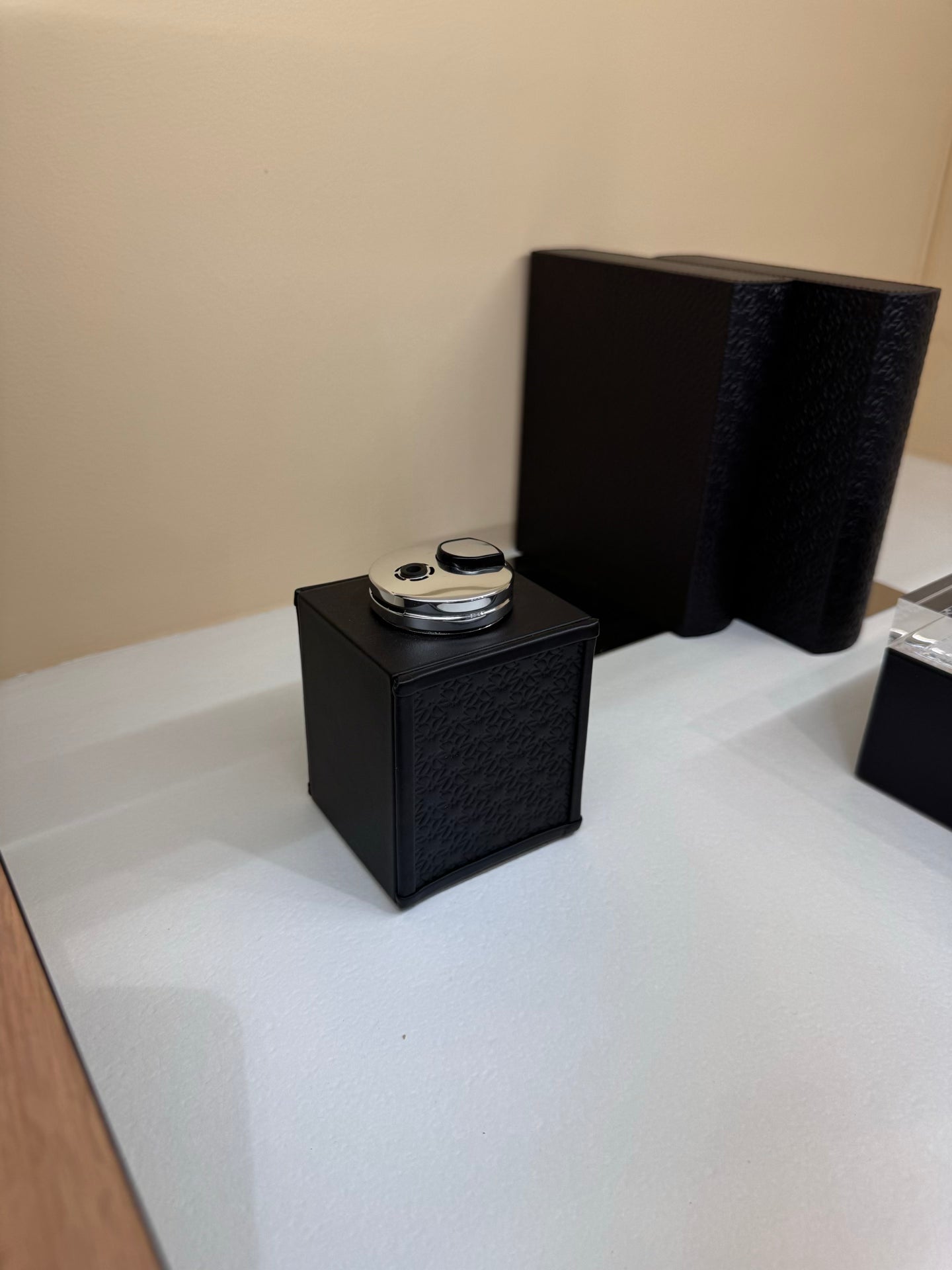 Giobagnara x Elie Saab Monogram Table Lighter | Table lighter with padded leather inserts featuring the Elie Saab Monogram pattern | Polished palladium details | Sophisticated and stylish accessory | Home Decor and Accessories | 2Jour Concierge, your luxury lifestyle shop