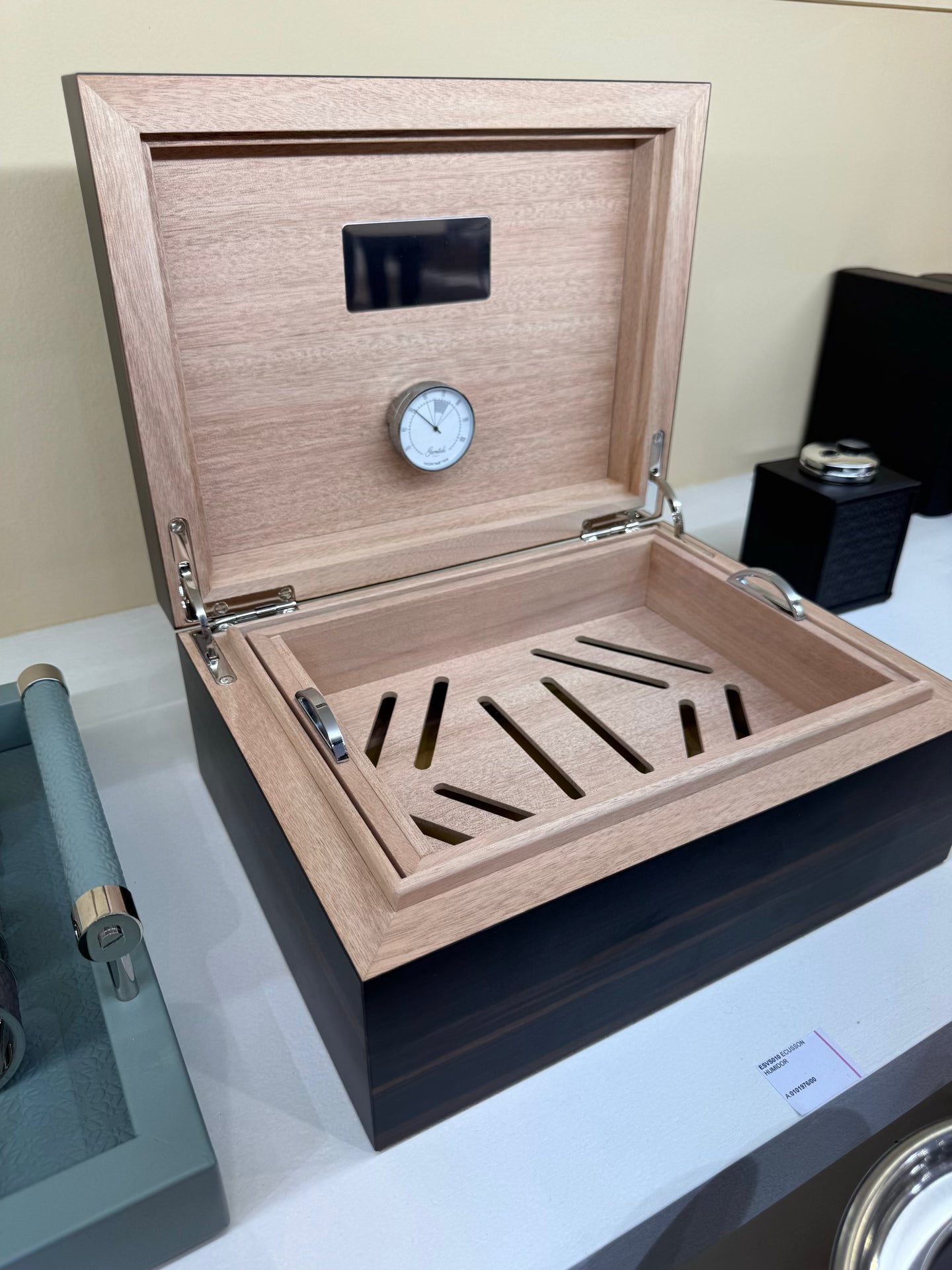 Giobagnara x Elie Saab Ecusson Cigar Humidor | Macassar ebony cigar humidor with padded leather inlay featuring the Elie Saab Monogram in polished palladium | Cedar wood lining | Luxurious and elegant storage for cigars | Home Decor and Accessories | 2Jour Concierge, your luxury lifestyle shop