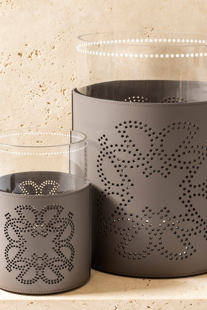Giobagnara  ×  Elie Saab | Ecusson Hurricane: Borosilicate glass with frosted decorations and Tecnocuoio® with perforated Elie Saab Monogram — small and large | Decor | 2Jour Concierge, your luxury lifestyle shop | luxury hurricane candle holder, Giobagnara Elie Saab, leather hurricane lamp, designer candle lantern