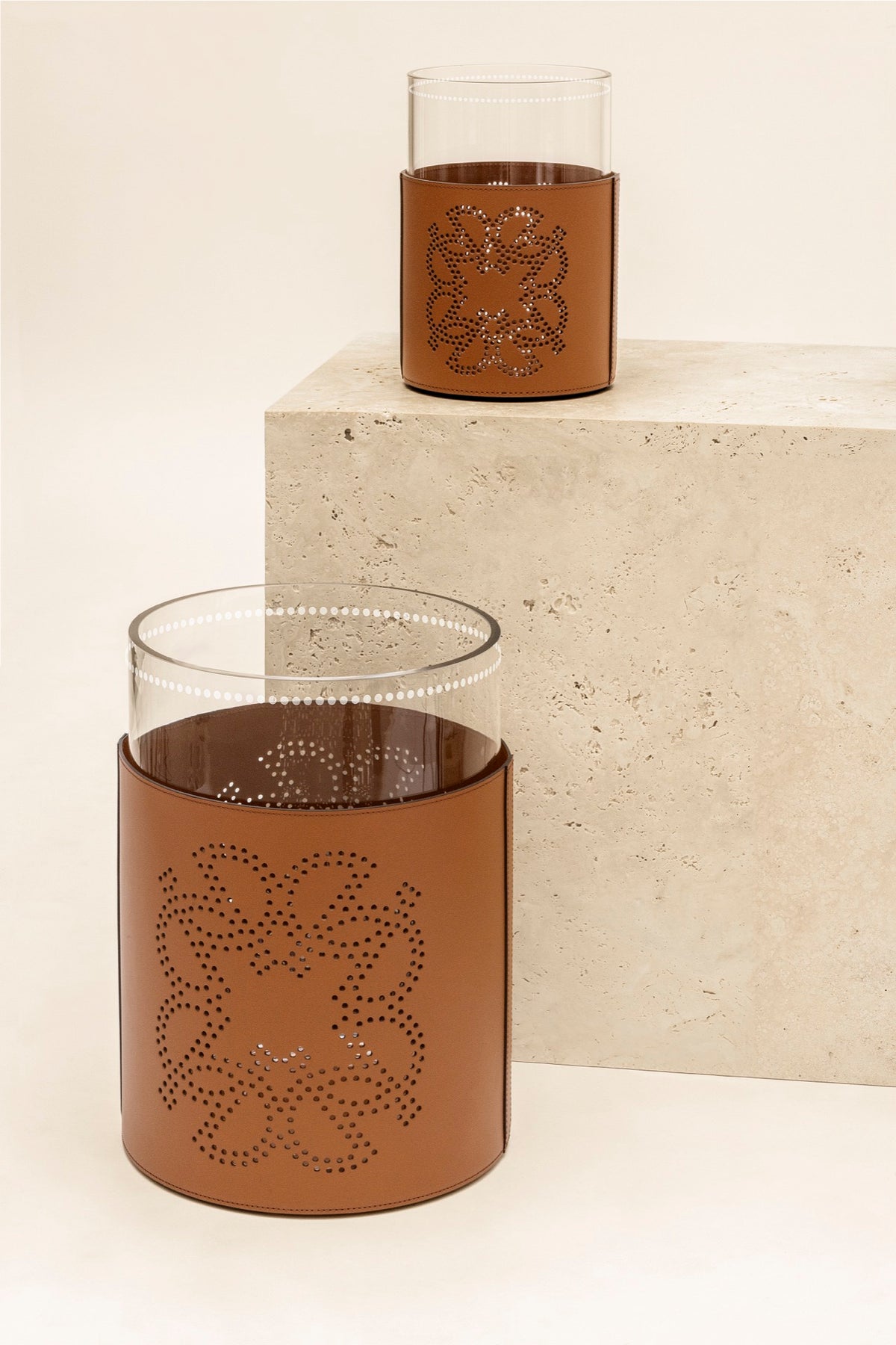 Giobagnara  ×  Elie Saab | Ecusson Hurricane: Borosilicate glass with frosted decorations and Tecnocuoio® with perforated Elie Saab Monogram — small and large | Decor | 2Jour Concierge, your luxury lifestyle shop | luxury hurricane candle holder, Giobagnara Elie Saab, leather hurricane lamp, designer candle lantern