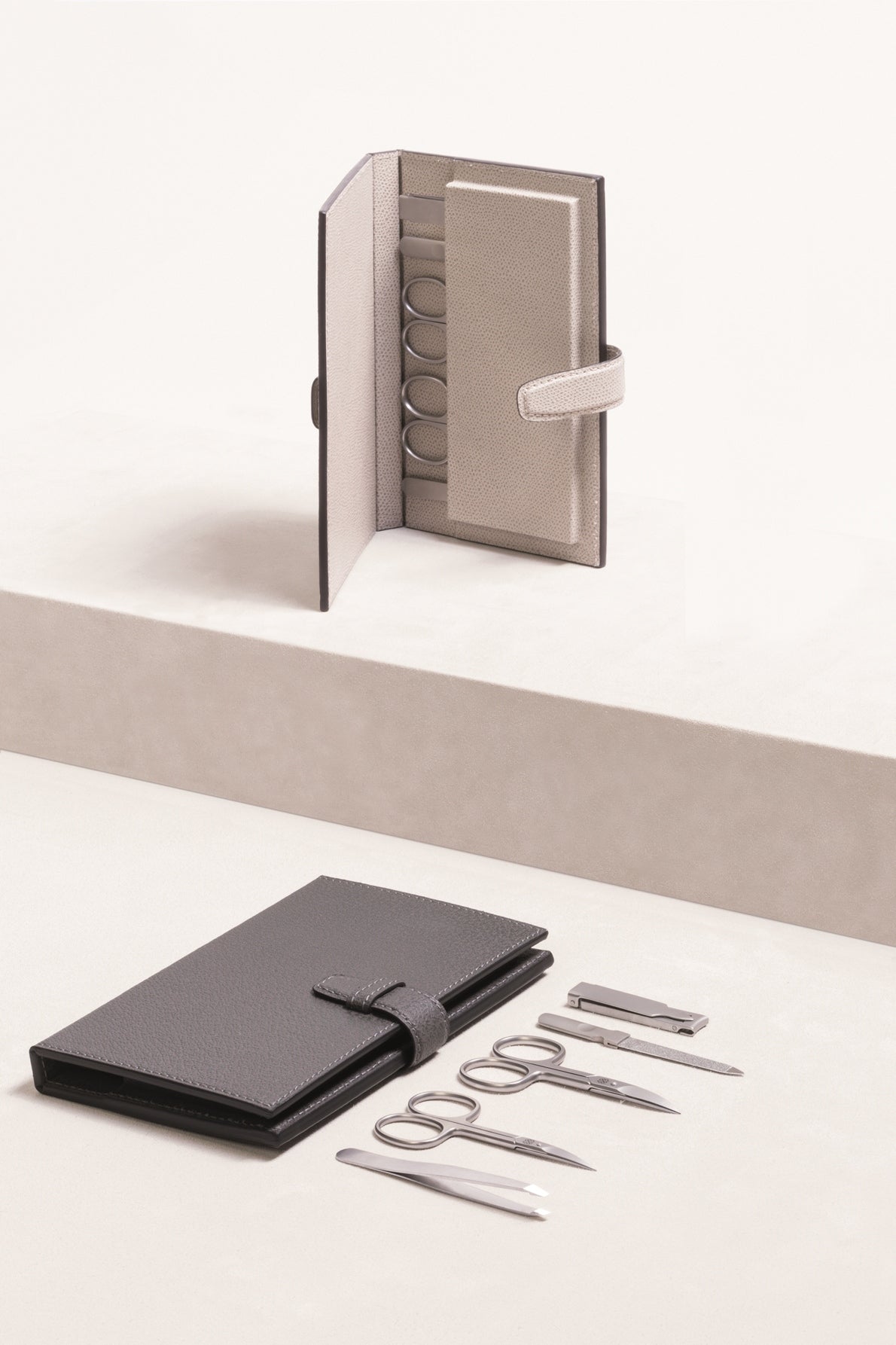 Giobagnara Vals Manicure Travel Set | Includes cuticle scissors, nail scissors, nail file, folding nail clipper, and slanted tweezers | Made in Italy with tempered stainless steel AISI420, nickel-free and sterilizable with sandblasted finish | Leather envelope with magnetic slots for secure storage, serving as a display when opened | Personal Care and Accessories | 2Jour Concierge, your luxury lifestyle shop