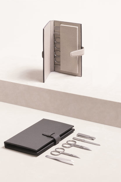 Giobagnara Vals Manicure Travel Set | Includes cuticle scissors, nail scissors, nail file, folding nail clipper, and slanted tweezers | Made in Italy with tempered stainless steel AISI420, nickel-free and sterilizable with sandblasted finish | Leather envelope with magnetic slots for secure storage, serving as a display when opened | Personal Care and Accessories | 2Jour Concierge, your luxury lifestyle shop