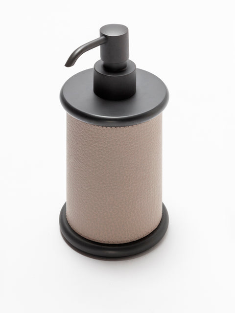 Giobagnara Ravello soap dispenser | Part of the Ravello bathroom collection | Elegant cylindrical form softened by rounded details and covered in velvety Italian leather | Non-slip waterproof base | Available in chrome, bronze, or brass finishes | Bathroom accessories | 2Jour Concierge, your luxury lifestyle shop