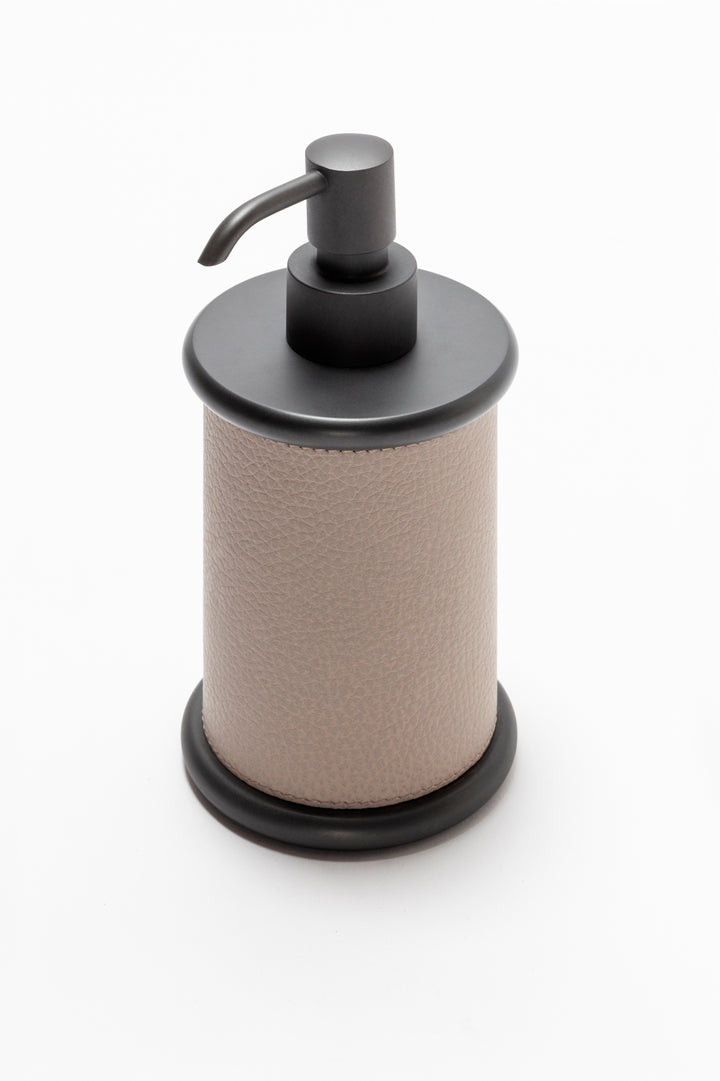 Giobagnara Ravello soap dispenser | Part of the Ravello bathroom collection | Elegant cylindrical form softened by rounded details and covered in velvety Italian leather | Non-slip waterproof base | Available in chrome, bronze, or brass finishes | Bathroom accessories | 2Jour Concierge, your luxury lifestyle shop