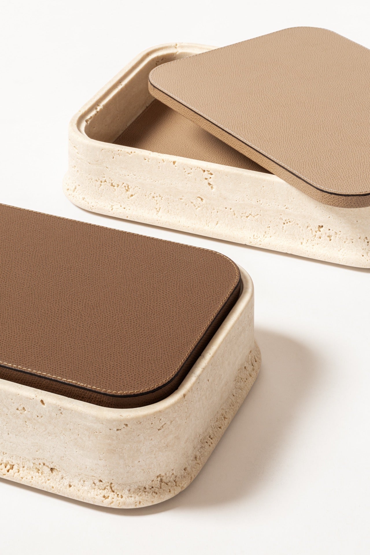 Giobagnara | Rodi Marble Box: Travertine marble with removable leather lid, available in various shapes and sizes | Decor / Trinket Boxes | 2Jour Concierge, your luxury lifestyle shop | Italian marble, natural texture, handcrafted detail, sculptural design
