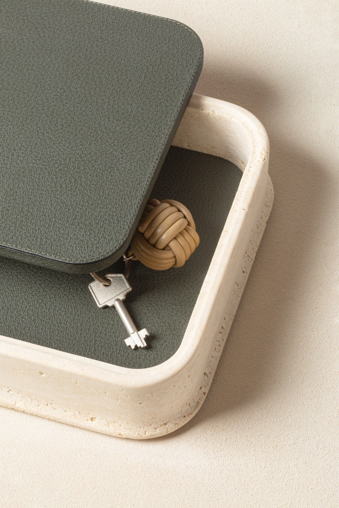Giobagnara | Rodi Marble Box: Travertine marble with removable leather lid, available in various shapes and sizes | Decor / Trinket Boxes | 2Jour Concierge, your luxury lifestyle shop | Italian marble, natural texture, handcrafted detail, sculptural design