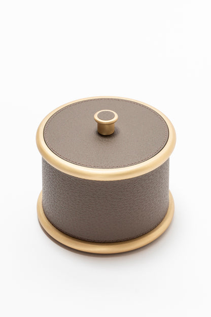 Giobagnara Ravello storage boxes | Part of the Ravello bathroom collection | Cylindrical metal boxes with lid, partially covered in fine Italian leather | Available in small and large sizes | Non-slip waterproof rubber base | Finished in chrome, bronze, or brass | Bathroom accessories | 2Jour Concierge, your luxury lifestyle shop