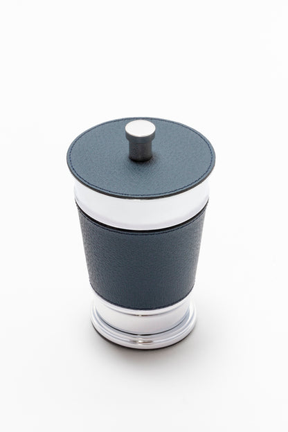 Giobagnara Manhattan trinket box | Elegant storage box with lid from the modern Manhattan collection | Leather-covered metal structure with sculptural contours | Finished with a non-slip waterproof rubber base | Available in chrome, bronze, or brass finishes | Bathroom accessories | 2Jour Concierge, your luxury lifestyle 