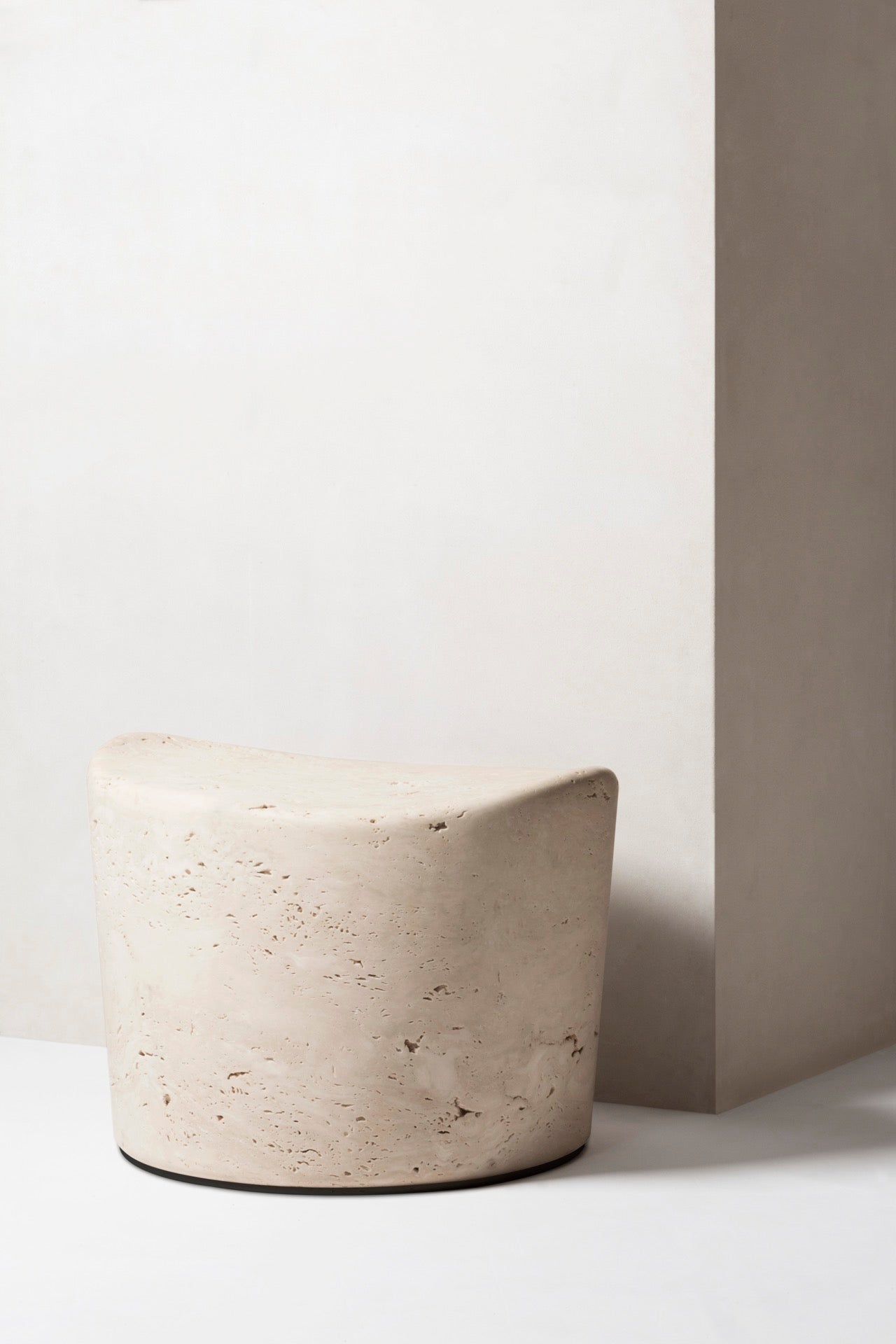 Giobagnara | Perseus Marble Pouf: Travertine construction on rotating base | Furniture / Stools | 2Jour Concierge, your luxury lifestyle shop | collectible furniture, natural stone, sculptural minimalism, refined interiors