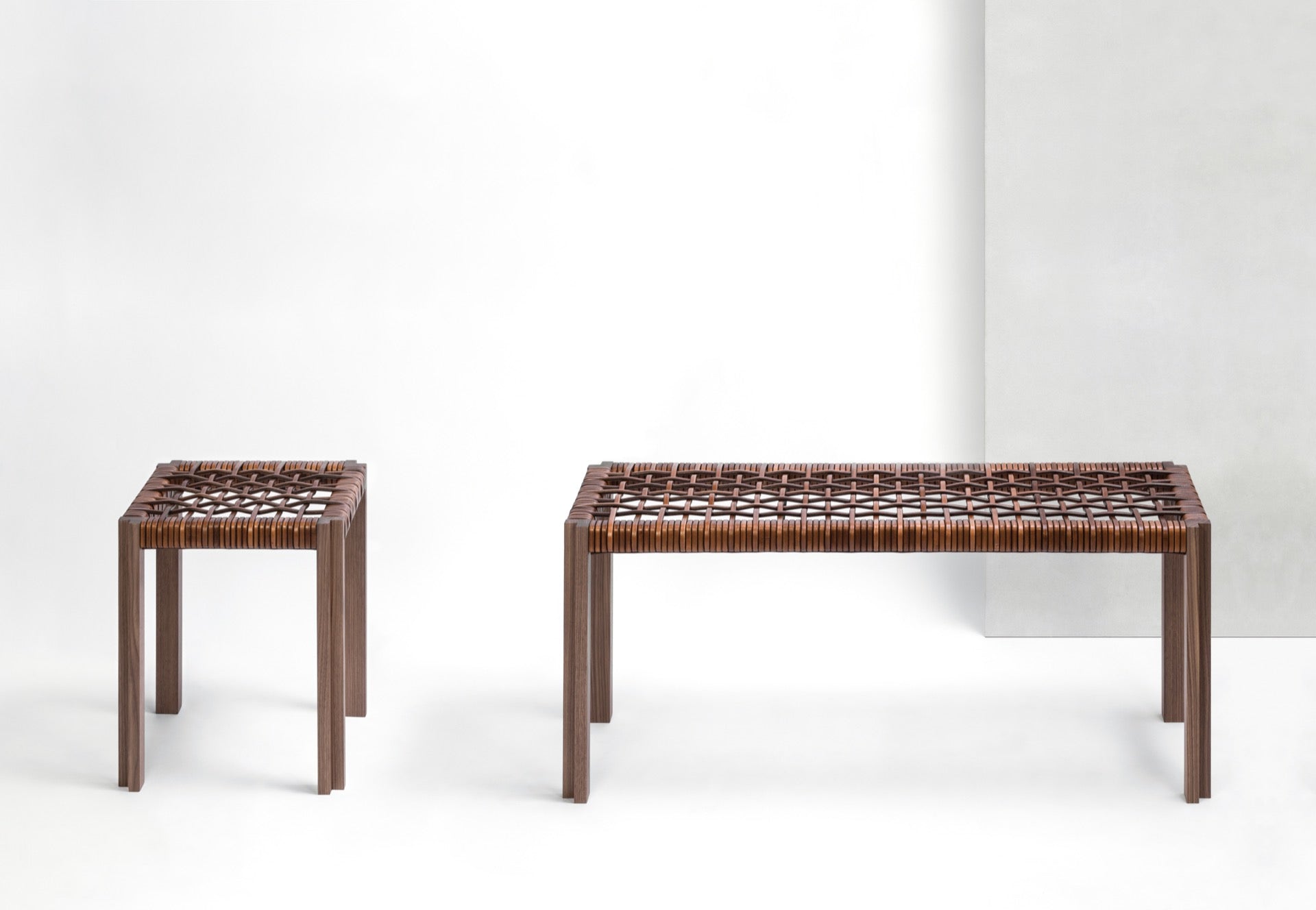 Giobagnara | Structura Crisscross Stool: Walnut wood stool with woven leather seat | Furniture / Stools | 2Jour Concierge, your luxury lifestyle shop | premium seating for expensive interiors, refined residences, and curated hospitality environments