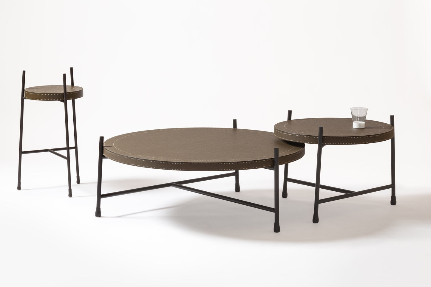 Giobagnara × Stéphane Parmentier Oblivion | Round Leather Coffee Tables: Leather tops in off-white or dark brown with bronze frame | Furniture / Coffee Tables | 2Jour Concierge, your luxury lifestyle shop | luxury interiors, hospitality décor, boutique hotels, yacht décor, executive offices, refined living