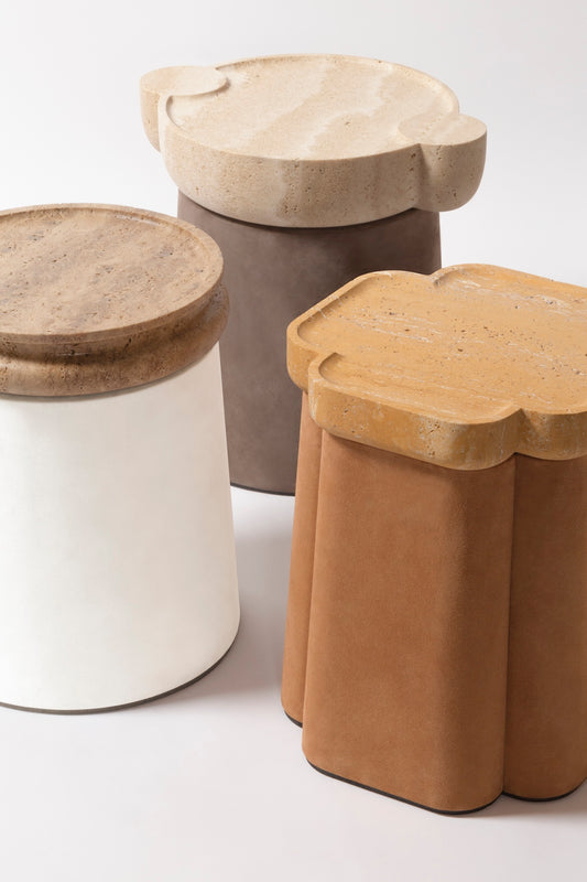 Giobagnara × Stéphane Parmentier Palladio | Side Tables: Suede leather bases with sculptural travertine tops in a selection of natural finishes, merging timeless elegance with modern sensibility | Furniture / Side Tables + Bar Tables | 2Jour Concierge, your luxury lifestyle shop | luxury interiors, hospitality décor, elegant living, boutique hotels, refined lifestyle, yacht décor, office décor, designer furniture