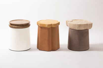 Giobagnara × Stéphane Parmentier Palladio | Side Tables: Suede leather bases with sculptural travertine tops in a selection of natural finishes, merging timeless elegance with modern sensibility | Furniture / Side Tables + Bar Tables | 2Jour Concierge, your luxury lifestyle shop | luxury interiors, hospitality décor, elegant living, boutique hotels, refined lifestyle, yacht décor, office décor, designer furniture